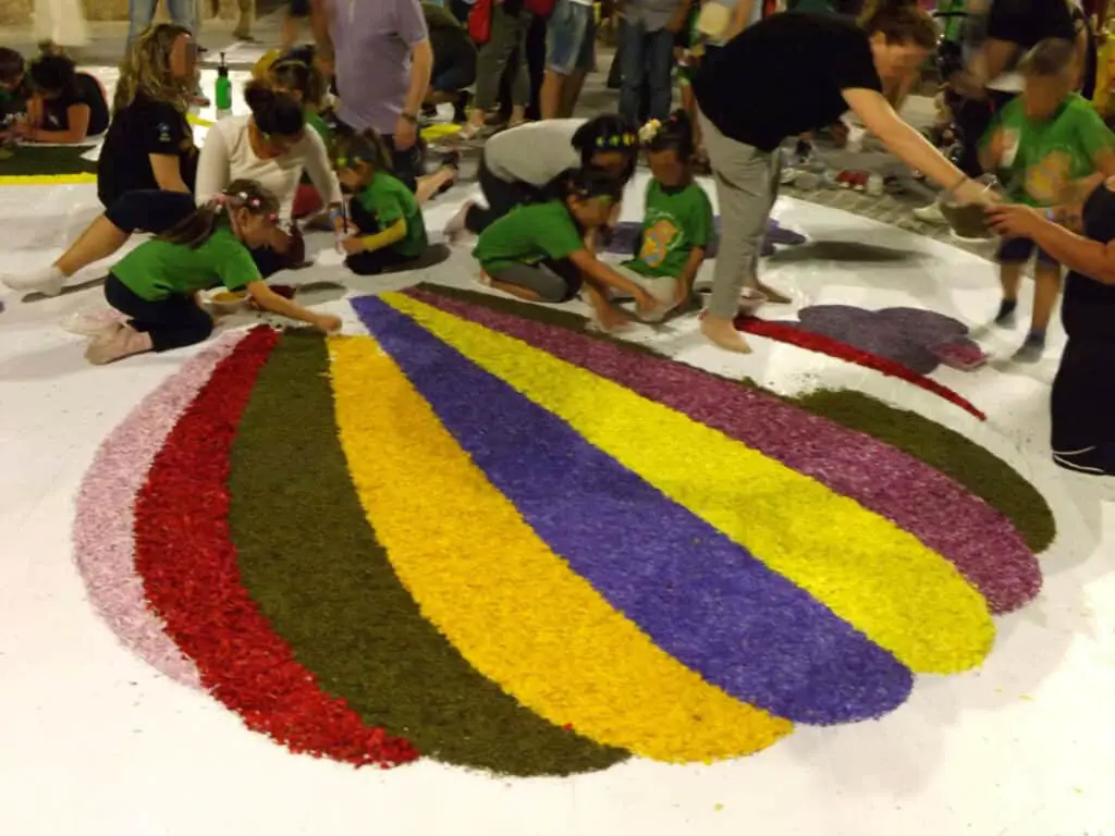 Italian pre-school children preparing decorations for a procession